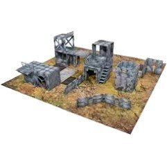 Grey ruined buildings, stairs, walkways and barricades laid out on a battlefield mat